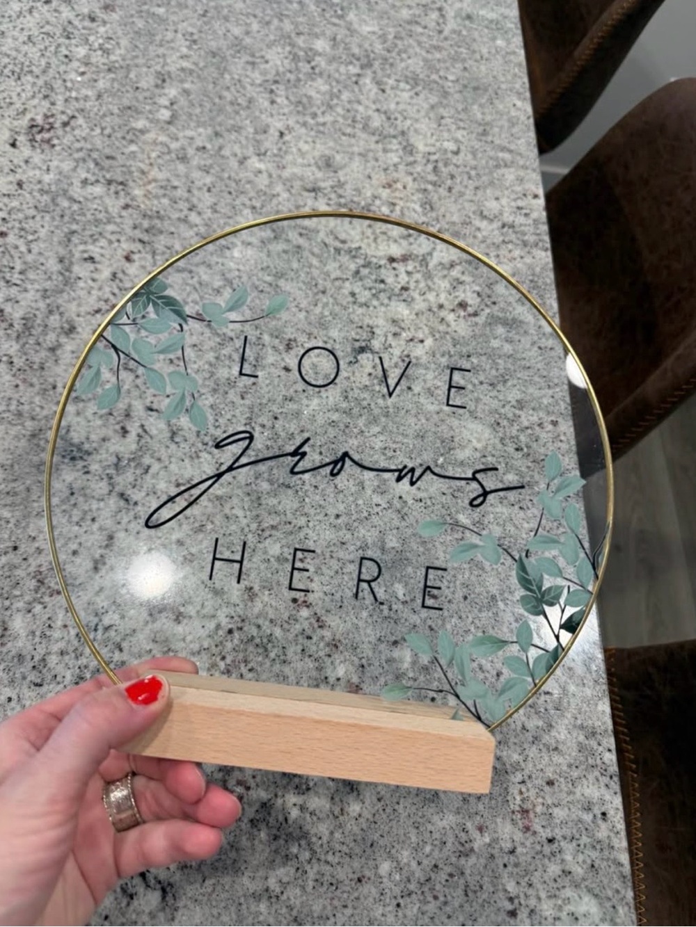 Round Glass Accent Sign "Love Grows Here" with Gold Rim